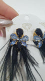 orecchini pendenti con piuma e cristallo piccolo di trik bijoux verde/ blu/ nero/ lilla