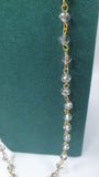 Collana lunga con pendente gemir con pietre grigie