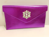Borsa cerimonia con patta piatta di Trik Bijoux magenta con gioiello