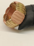 Bracciale con molla elastica placca oro e rosa cipria